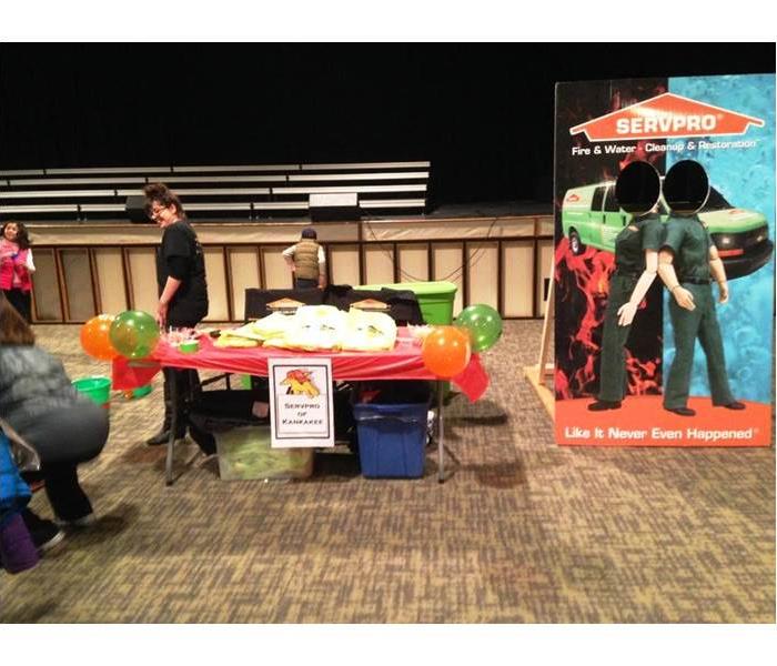 table with SERVPRO cardboard cut out on the side