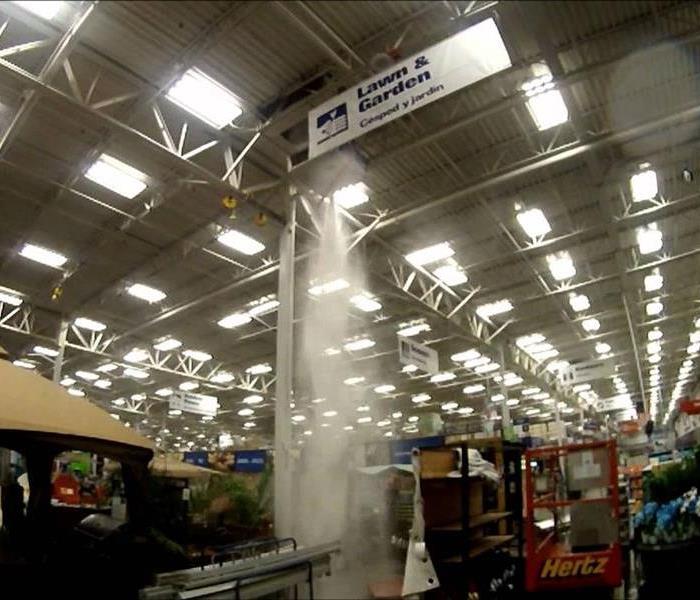 Fire sprinkler going off in a department store