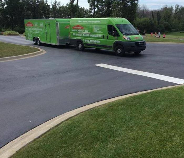 SERVPRO truck and trailer driving on the street